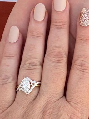 Vintage-Inspired Gold and Silver Halo Ring with Pear-Cut Center Stone